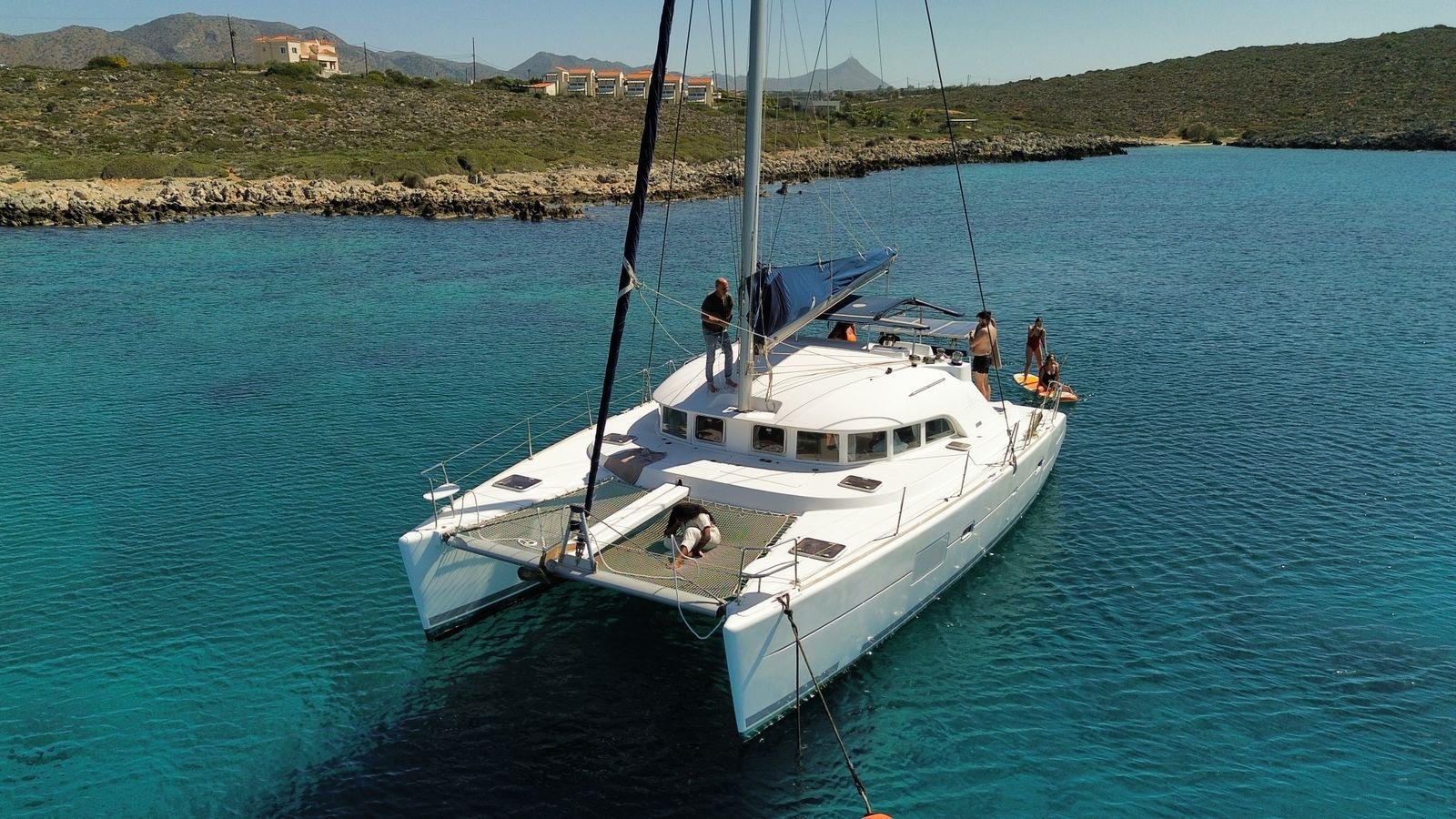 Catamaran at anchor in clear Caribbean water